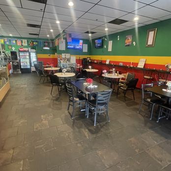 Sylvain's Caribbean Restaurant - tables and chairs - Caribbean Near Me - Palm Coast, Florida Sylvain's Caribbean Restaurant - tables and chairs - Caribbean Near Me - Palm Coast, Florida