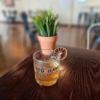 Red Hare Brewing & Distilling - a glass of alcohol on a table - Breweries Near Me - Marietta, Georgia