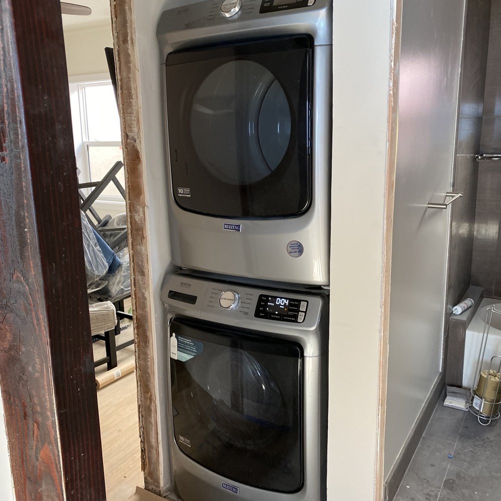 Stacked washer drier installation in tight space Stacked washer drier installation in tight space