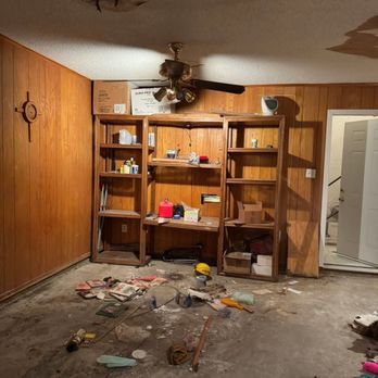 MTC Junk Removal Services - Cluttered storage room with water-damaged ceiling, wood-paneled walls, and overloaded shelving units... - Junk Removal & Hauling Near Me - McKinney, Texas MTC Junk Removal Services - Cluttered storage room with water-damaged ceiling, wood-paneled walls, and overloaded shelving units... - Junk Removal & Hauling Near Me - McKinney, Texas