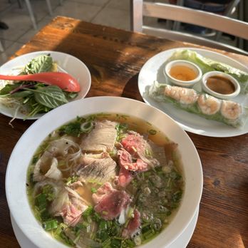 Berni Vietnamese Restaurant - Large rare steak and brisket pho (front), pork and shrimp spring rolls (back) - Vietnamese Near Me - San Antonio, Texas