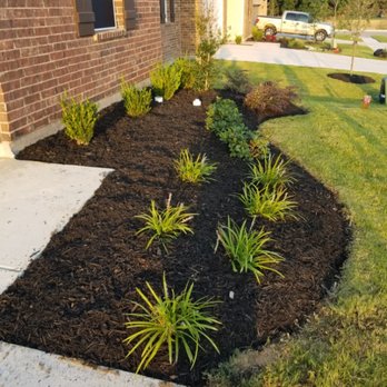 JT Lawn Service - a front yard of a house - Lawn Services Near Me JT Lawn Service - a front yard of a house - Lawn Services Near Me