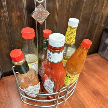 Roux Dat - Condiments at the table - Cajun/Creole Near Me - Capitola, California Roux Dat - Condiments at the table - Cajun/Creole Near Me - Capitola, California
