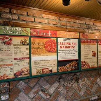 Round Table Pizza - menus on a brick wall - Pizza Near Me - Torrance, California Round Table Pizza - menus on a brick wall - Pizza Near Me - Torrance, California