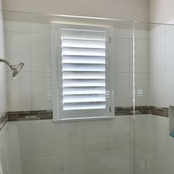 Budget Blinds of Indian River County - These classic shutters in this local Vero Beach shower bring a clean, timeless look while withstanding moisture and daily use.
