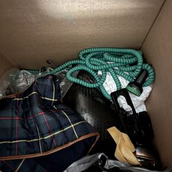 All American Relocation - Photo of one box where thew threw a hose on top of clothes.