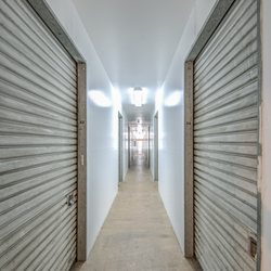 SecurePro Storage of Redwood City - Well-lit interior hallway storage units in RWC