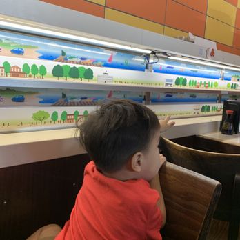Genki Sushi - Son-son waiting for our sushi - Sushi Bars Near Me - Honolulu, Hawaii