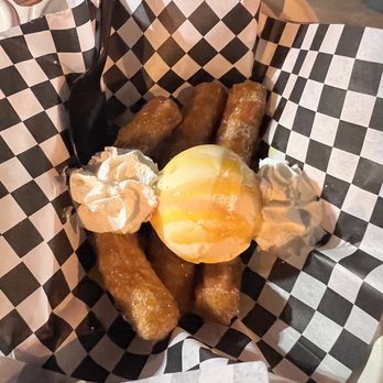 Churro Addict - Churro sundae with vanilla ice cream, whipped cream and guava& mango drizzle. - Food Trucks Near Me - San Diego, California Churro Addict - Churro sundae with vanilla ice cream, whipped cream and guava& mango drizzle. - Food Trucks Near Me - San Diego, California
