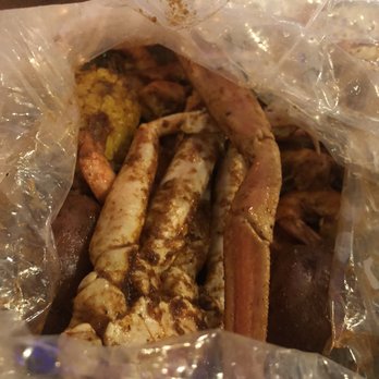 Crafty Crab - Boom Sauce with Fire seasoning. Snow Crab Legs and Headless Shrimp with corn, potatoes and deviled eggs - Seafood Near Me - Towson, Maryland