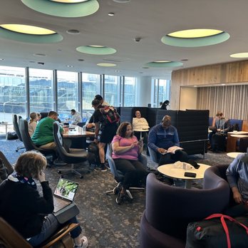 The Centurion Lounge - a group of people sitting around a table - Airport Lounges Near Me - Philadelphia, Pennsylvania The Centurion Lounge - a group of people sitting around a table - Airport Lounges Near Me - Philadelphia, Pennsylvania