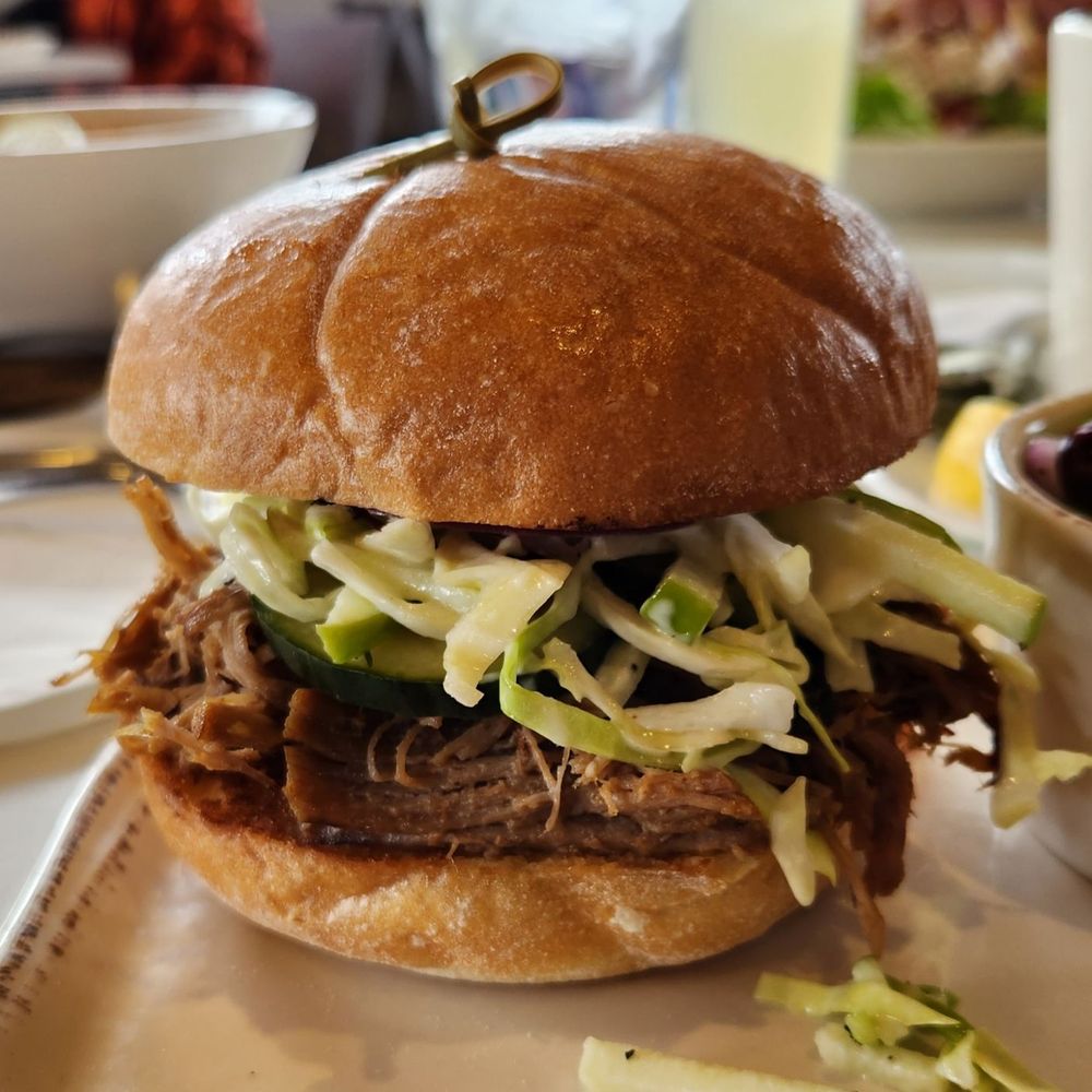 Tula's Kitchen - Pork tenderloin sandwich being all proud of itself, as it should be. Mondo sammie!!! - New American Near Me - Albuquerque, New Mexico Tula's Kitchen - Pork tenderloin sandwich being all proud of itself, as it should be. Mondo sammie!!! - New American Near Me - Albuquerque, New Mexico