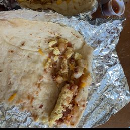 Potato, bacon, egg, and cheese taco (Silent Sean). Very pathetic serving, all I could taste was tortilla. Potato, bacon, egg, and cheese taco (Silent Sean). Very pathetic serving, all I could taste was tortilla.