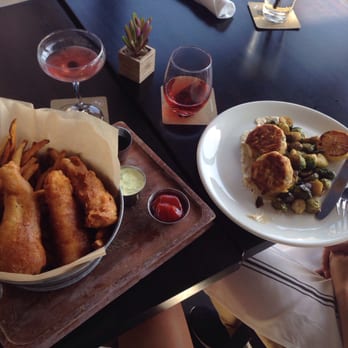 The General Public - Fish and chips, crab cake, and two of the "rose all day" beverages - New American Near Me - San Antonio, Texas The General Public - Fish and chips, crab cake, and two of the "rose all day" beverages - New American Near Me - San Antonio, Texas