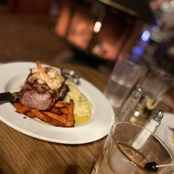 Jubilee Railroad - My 14oz Harris Ranch rib eye came with garlic mashed potatoes and glazed carrots $44 + 4 prawn $8 (11/8/22).