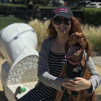 Village Green Dog Park - Wife and dog on one of the benches outside the fenced in area. - Dog Parks Near Me - Mountain View, California