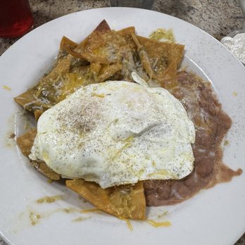 Carolyn's Cafe - This is the amazing mild green Mexican Chiliqulies with fresh refried beans and two over medium mix - Breakfast & Brunch Near Me - Redlands, California