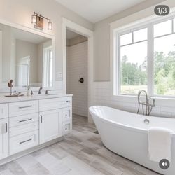 Sparkling Cleaning Services - Bathroom deep clean: tile, shower, bathtub, and toilet disinfected; fixtures polished; floor sanitized; spotless finish.