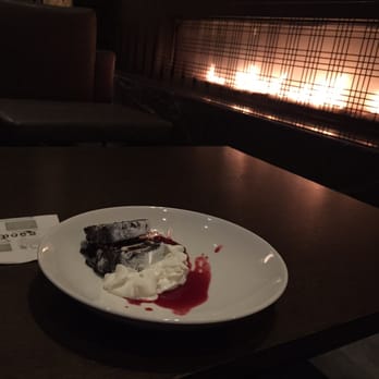 Apropoe's - Flourless chocolate cake and fireplace. Next time, I may go for a drink and app rather than this dessert. - New American Near Me - Baltimore, Maryland