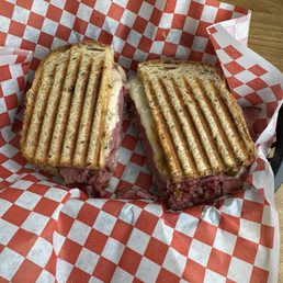 Rueben- pastrami, thousand island, Swiss, sauerkraut on a rye bread.