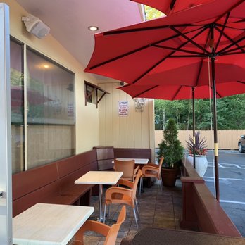 Greek Bites - Cute little booth type setup on each side. Perfect for outdoor dining...when it's warm out. - Greek Near Me - Moriches, New York Greek Bites - Cute little booth type setup on each side. Perfect for outdoor dining...when it's warm out. - Greek Near Me - Moriches, New York