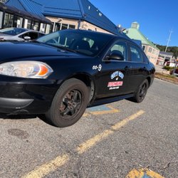 City Cab of Fitchburg - Bright blue and red logo on our cars