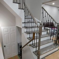 Assani Home Renovations - New stair flooring and railings installed