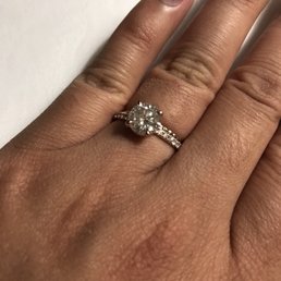 18k rose gold diamonds to each side with grandmas diamond.
