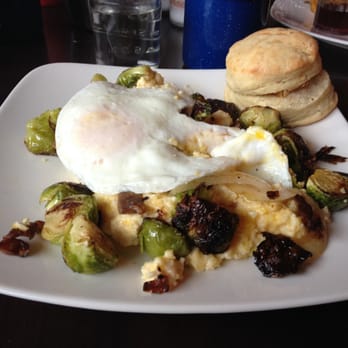 Swift Lounge - Farmers' Breakfast: roasted brussel sprouts with bacon and onions layered over cheesy grits and two eggs over medium. What. - Lounges Near Me - Portland, Oregon