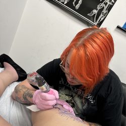 Invisibleself Piercing & Jewelry - Outer thigh tat wit Rebecca
