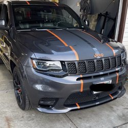 Matte black racing stripes with glossy metallic bronze pinstripe done with knifeless tape