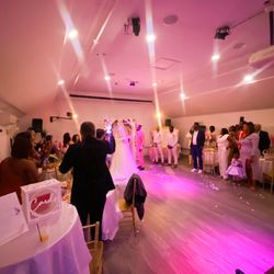 Boston Studio Rental - Wedding ceremony with high ceilings, colorful uplighting, and unforgettable memories at Boston Studio Rental.