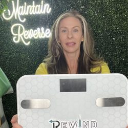 Rewind Wellness & Aesthetics - Photo wall with a swing! This scale has seen sooo many people loose weight!  Happy smiles and happy people
