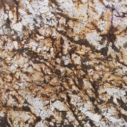 Flipping Yuma - Creamy white fragments are embraced by veins of chocolate and blended with blonde and golden caramel in our Normandy granite from Brazil.