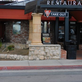 BJ's Restaurant & Brewhouse - When you come to BJs you allways see the take out sign and the many great bargains sign that is near the door . - Pizza Near Me - La Mesa, California