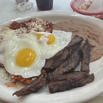 Dichos Taqueria - Chilaquiles Guajillo sauce and beef fajita with two eggs - Mexican Near Me - Houston, Texas Dichos Taqueria - Chilaquiles Guajillo sauce and beef fajita with two eggs - Mexican Near Me - Houston, Texas
