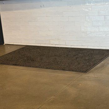 Black Rock Coffee Bar - Dirty Floor and Mat at Counter - Coffee & Tea Near Me - Surprise, Arizona Black Rock Coffee Bar - Dirty Floor and Mat at Counter - Coffee & Tea Near Me - Surprise, Arizona