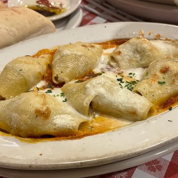 Buca di Beppo Italian Restaurant - Stuffed Shells - pasta shells w/ spicy Italian sausage, spinach, ricotta & Parmesan w/ Alfredo & homemade marinara sauce! - Italian Near Me - Universal City, California Buca di Beppo Italian Restaurant - Stuffed Shells - pasta shells w/ spicy Italian sausage, spinach, ricotta & Parmesan w/ Alfredo & homemade marinara sauce! - Italian Near Me - Universal City, California