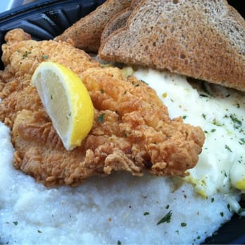 Donut King - Catfish & grits platter. Includes scrambled eggs with provolone. - Donuts Near Me - Minneola, Florida Donut King - Catfish & grits platter. Includes scrambled eggs with provolone. - Donuts Near Me - Minneola, Florida