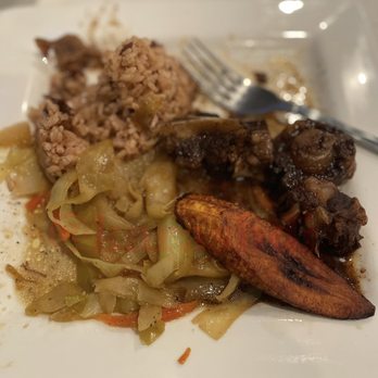 Aunty Joy's Jerk & Pizza - Jamaican Style Oxtail Plantains Steamed Cabbage Plantains Rice - Caribbean Near Me - Chicago, Illinois Aunty Joy's Jerk & Pizza - Jamaican Style Oxtail Plantains Steamed Cabbage Plantains Rice - Caribbean Near Me - Chicago, Illinois