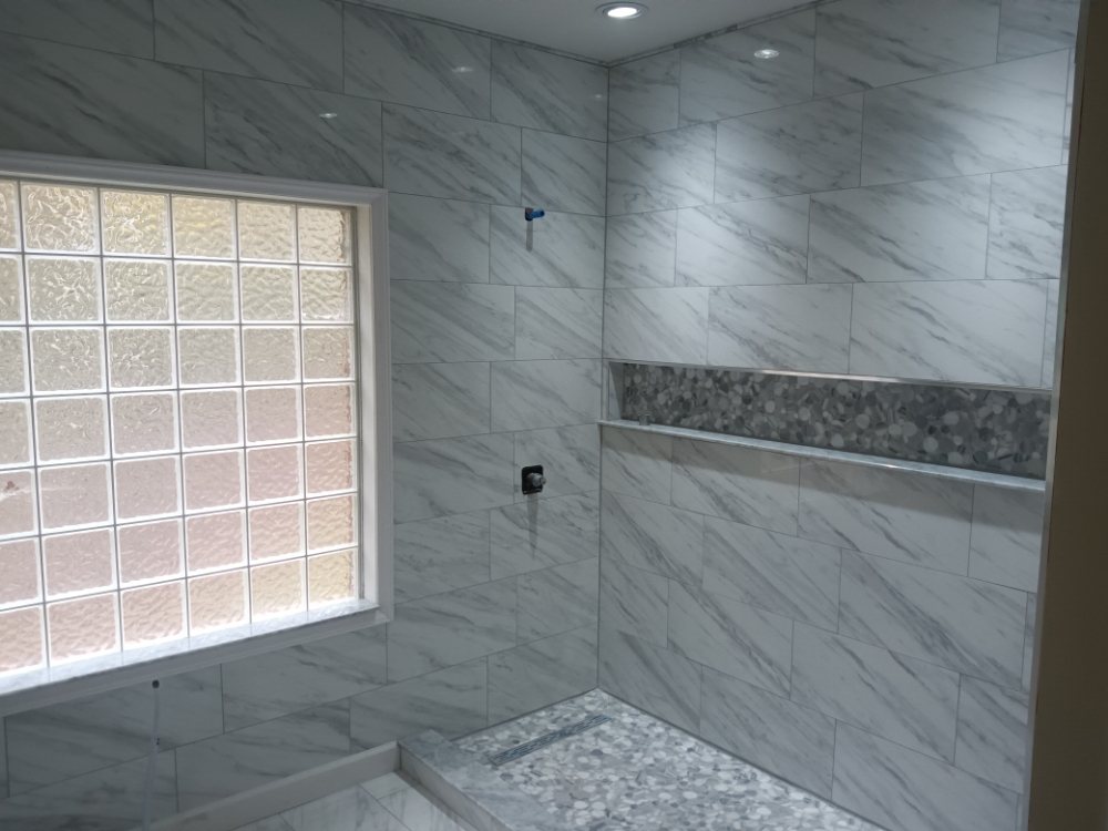 Slide of Bathmatic Custom Tile and Shower
