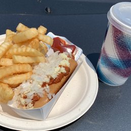 Frank with chili, cheese and onion, fries and soda.