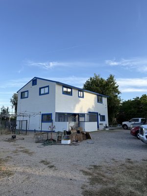 From Siding to Stucco - This Chandler home came to us with severely deteriorated wood siding and no curb appeal to speak of. The homeowner wanted a full transformation, and a look that honored his roots in Turkey. We partnered with J.C. Plastering LLC who handled a complete stucco application, then ShieldCoat applied Loxon primer and Sherwin-Williams Duration exterior paint in a crisp white with bold blue trim. The before and after says everything. From Siding to Stucco - This Chandler home came to us with severely deteriorated wood siding and no curb appeal to speak of. The homeowner wanted a full transformation, and a look that honored his roots in Turkey. We partnered with J.C. Plastering LLC who handled a complete stucco application, then ShieldCoat applied Loxon primer and Sherwin-Williams Duration exterior paint in a crisp white with bold blue trim. The before and after says everything.