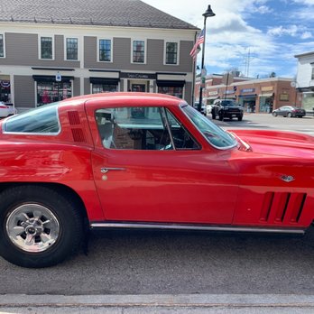 Main Streets Café - a red sports car parked in a parking lot - American Near Me - Concord, Massachusetts Main Streets Café - a red sports car parked in a parking lot - American Near Me - Concord, Massachusetts