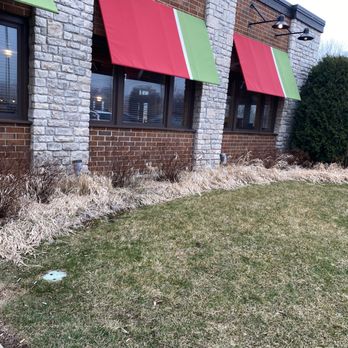 Chili's - the outside of a restaurant with red and green awnings - Bars Near Me - Round Lake Beach, Illinois