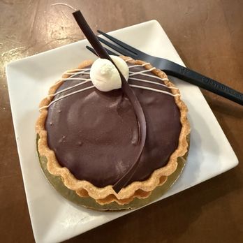 French Broad Chocolate Lounge - Dark chocolate and caramel tart - Chocolatiers & Shops Near Me - Asheville, North Carolina French Broad Chocolate Lounge - Dark chocolate and caramel tart - Chocolatiers & Shops Near Me - Asheville, North Carolina