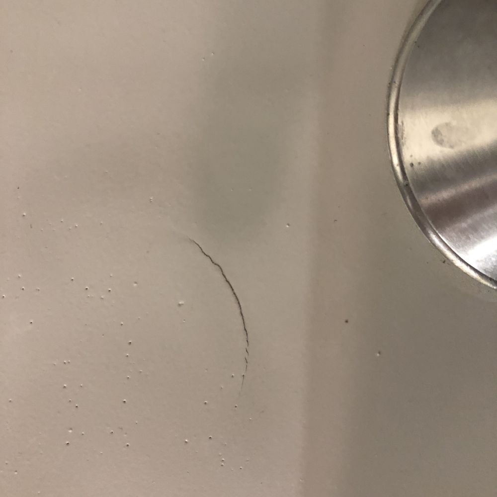 Advanced Bathtub - Crack on horizontal, non-loadbearing tub surface. - Refinishing Services Near Me