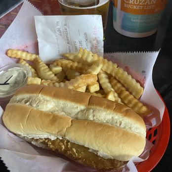Kozzys - Fish Sandwich served with fries - Cocktail Bars Near Me - De Soto, Missouri Kozzys - Fish Sandwich served with fries - Cocktail Bars Near Me - De Soto, Missouri