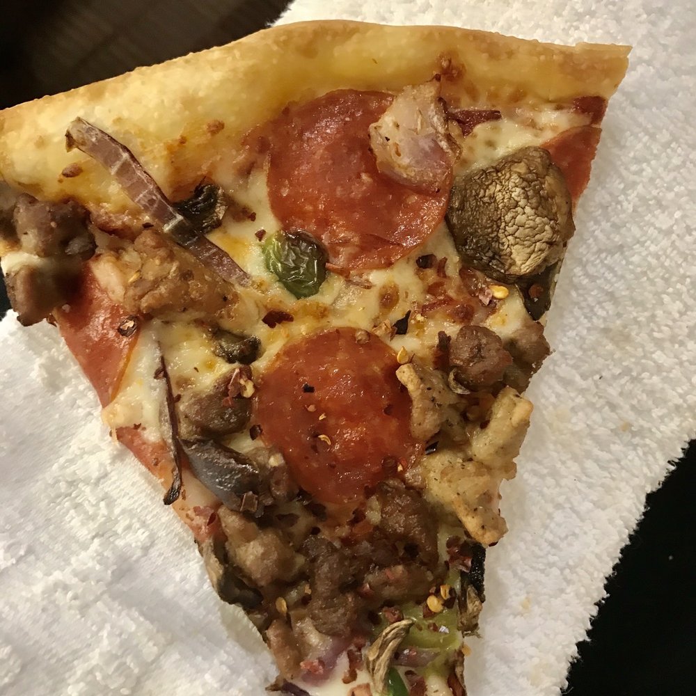 a slice of pizza on a napkin