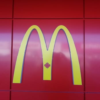 McDonald's - a mcdonald's logo on a red wall - Fast Food Near Me - New Westminster, British Columbia McDonald's - a mcdonald's logo on a red wall - Fast Food Near Me - New Westminster, British Columbia